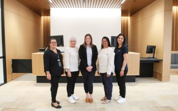 Picture of City of Fremantle staff in front of customer service desk.